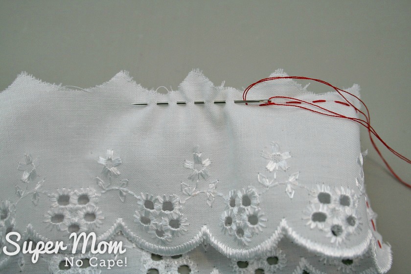 Sewing the running stitch on the top of the lace for the Christmas Button Lace Ornament