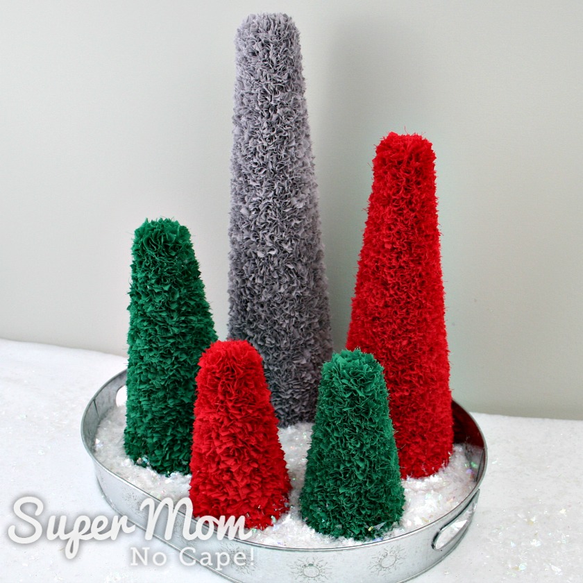 Five Poke and Push Christmas Trees in a silver tray