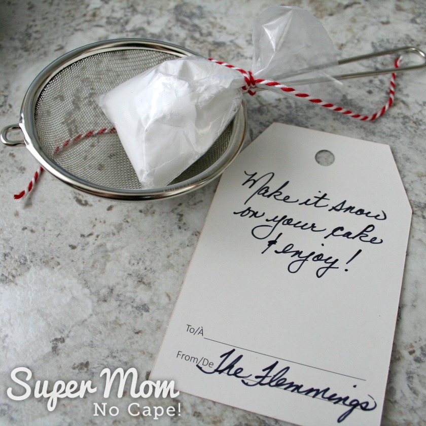 Small strainer, small bag of icing sugar and gift tag