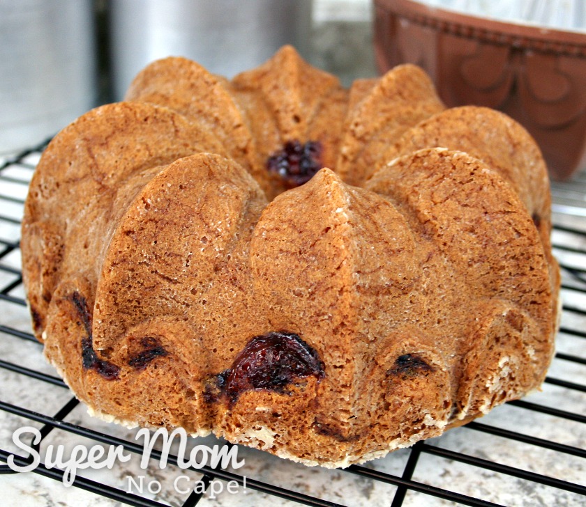 Coffee cake with cranberry swirls on cooking rack