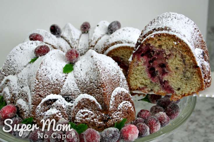 Lifting slice of Cranberry Coffee Cake off plate