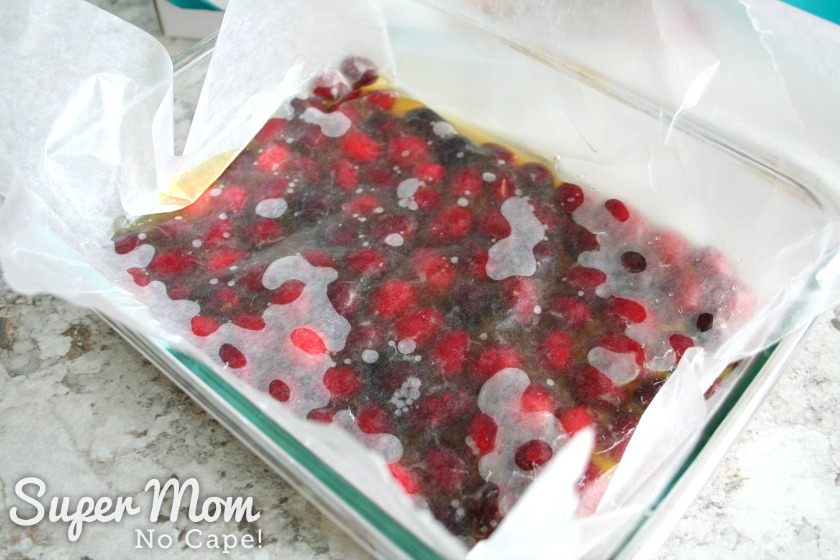 Layer of waxed paper over cranberries and orange mixture
