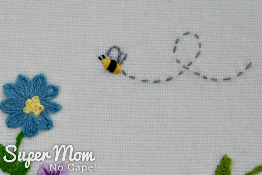 One of the embroidered bees from the Hello Spring embroidery pattern