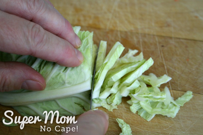 Slicing cabbage thinly for the filling for homemade egg rolls