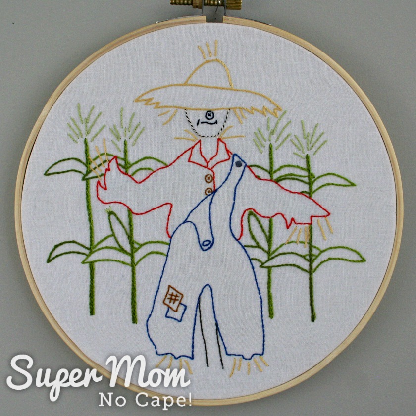 Embroidered Strawbyn Scarecrow in wooden hoop