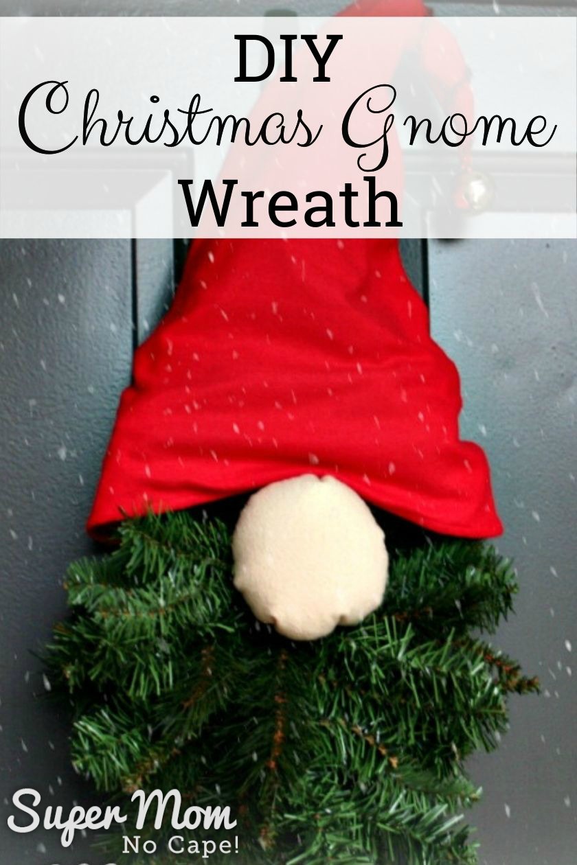 Photo of a Gnome Wreath hanging on a black door with a text over lay