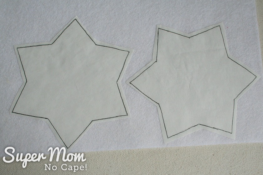 Two freezer paper stars fused to the white felt.