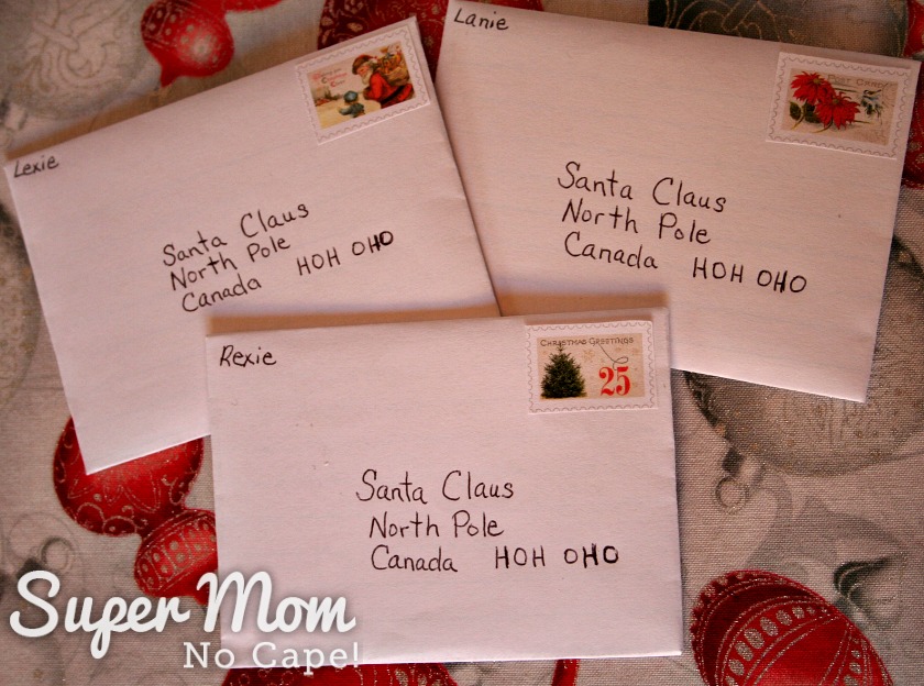 Three small envelopes addressed to Santa at the North Pole