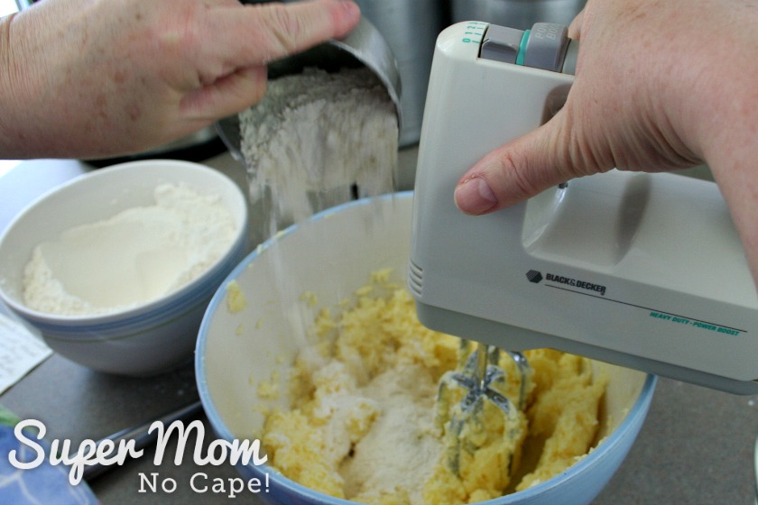 Adding the flour to the butter mixture gradually