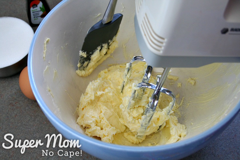 Creaming the butter in the mixing bowl using a hand held mixer