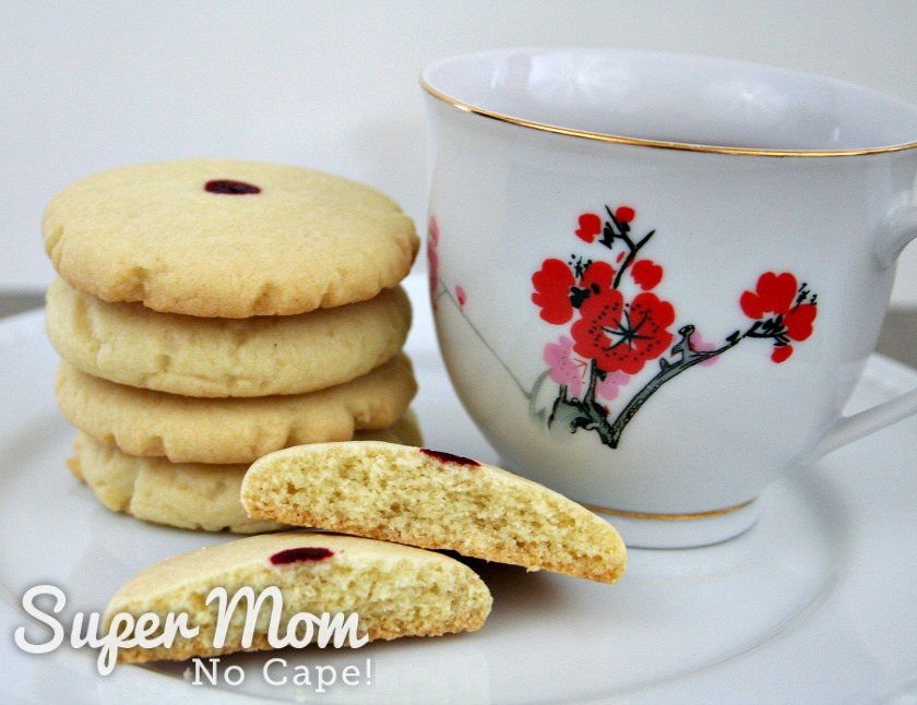 Red dot almond cookies served with a cup of tea