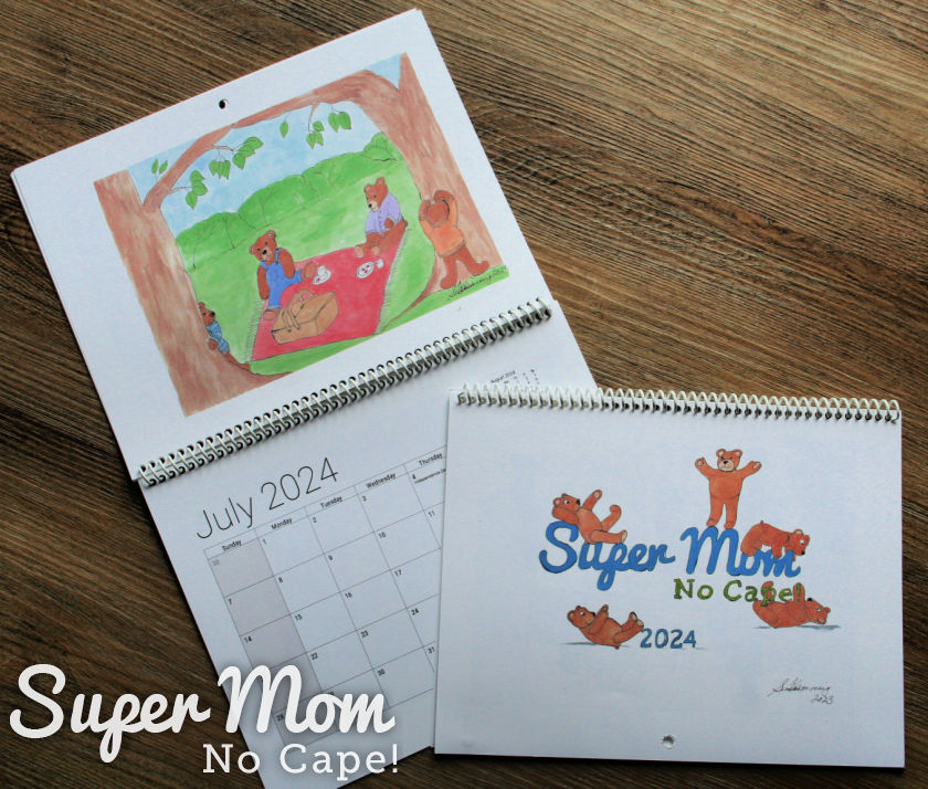 Picture of two of the 2024 Super Mom No Cape Teddy Bear Calendars (July showcased)